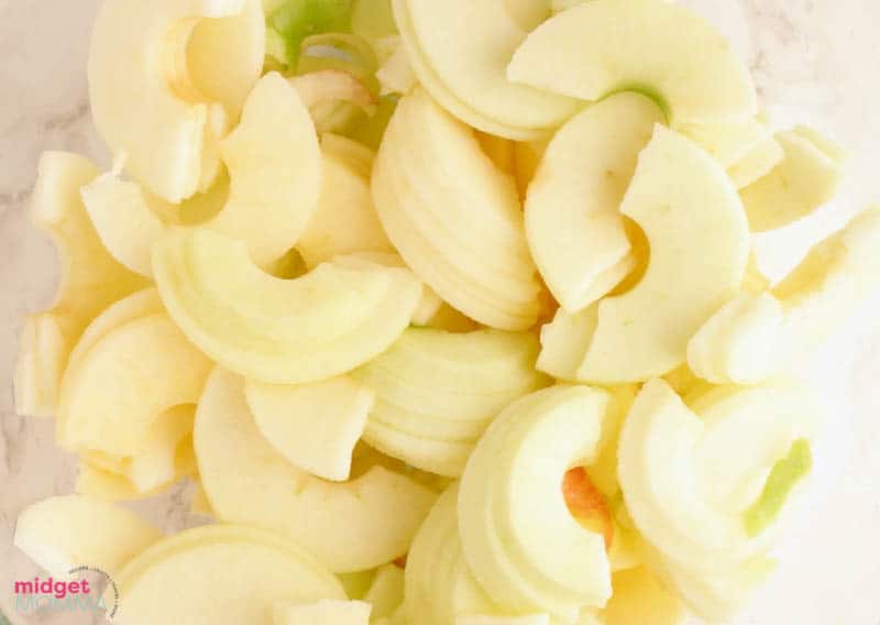 peeled and sliced apples in a bowl