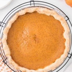 homemade pumpkin pie in a pie dish.