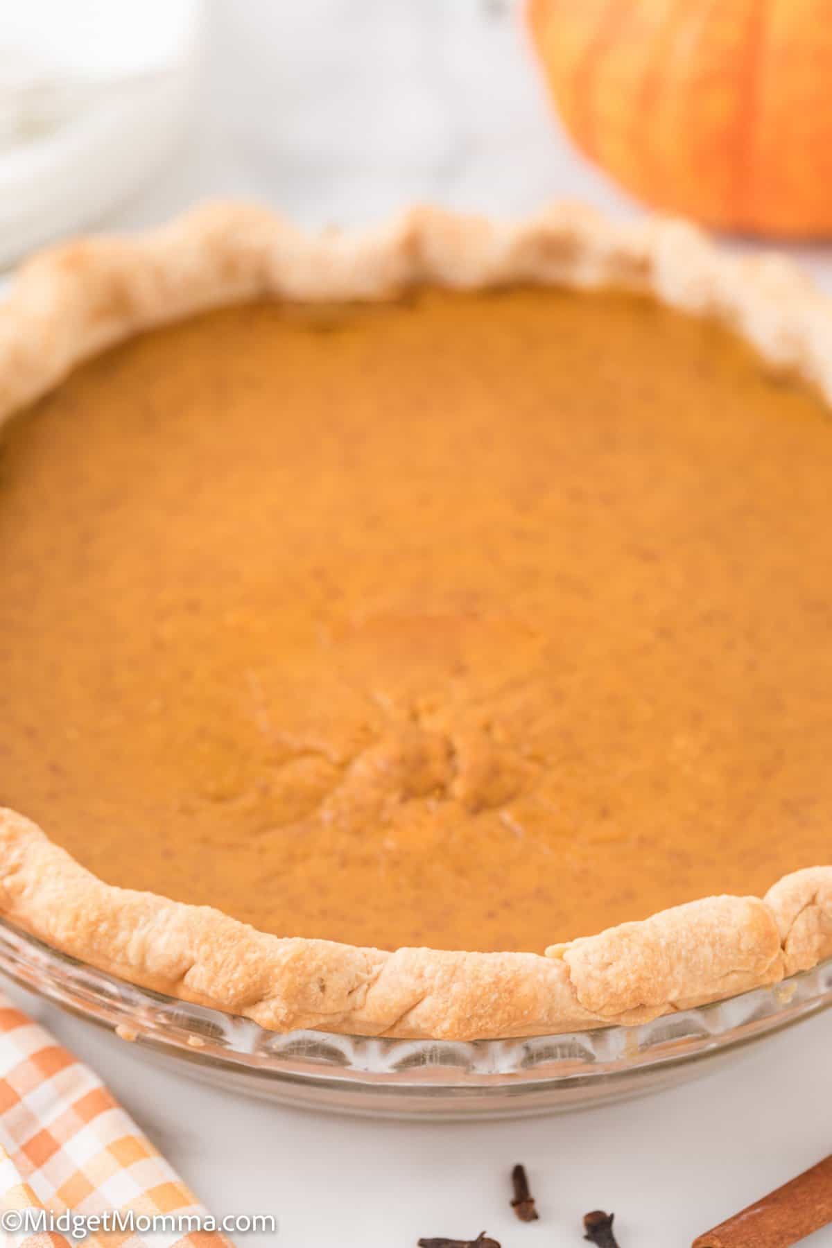 homemade pumpkin pie in a pie dish