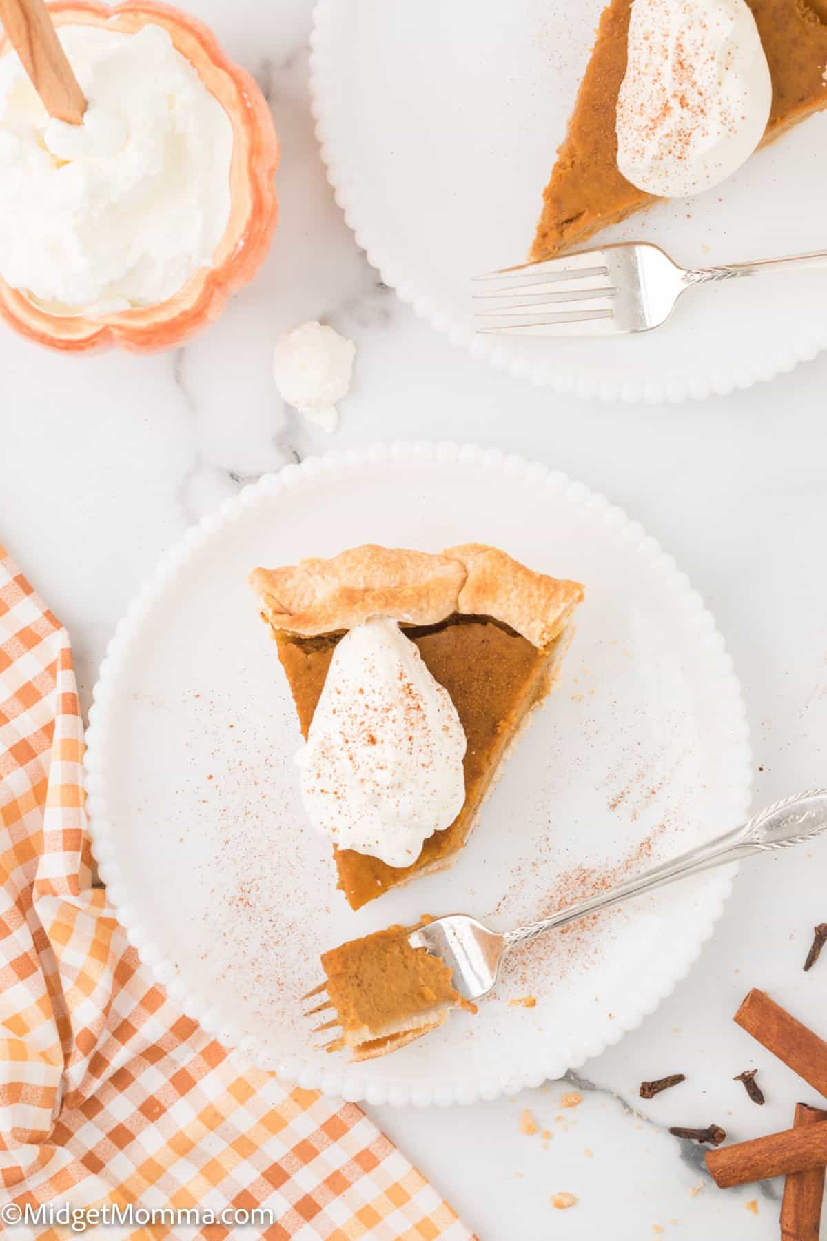 overhead photo of a slice of homemade pumpkin pie on a plate.