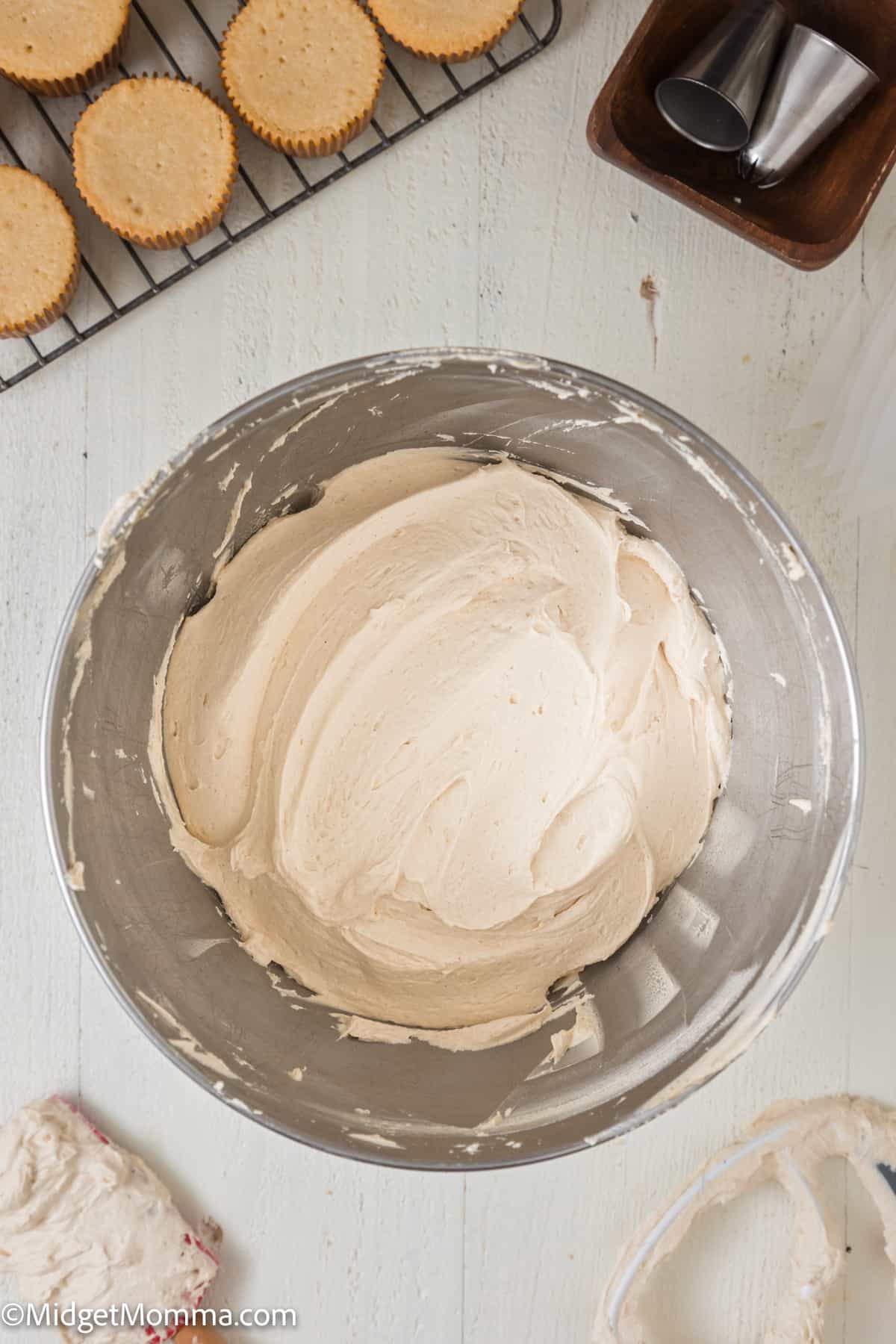 finished icing in the bowl of a stand mixer