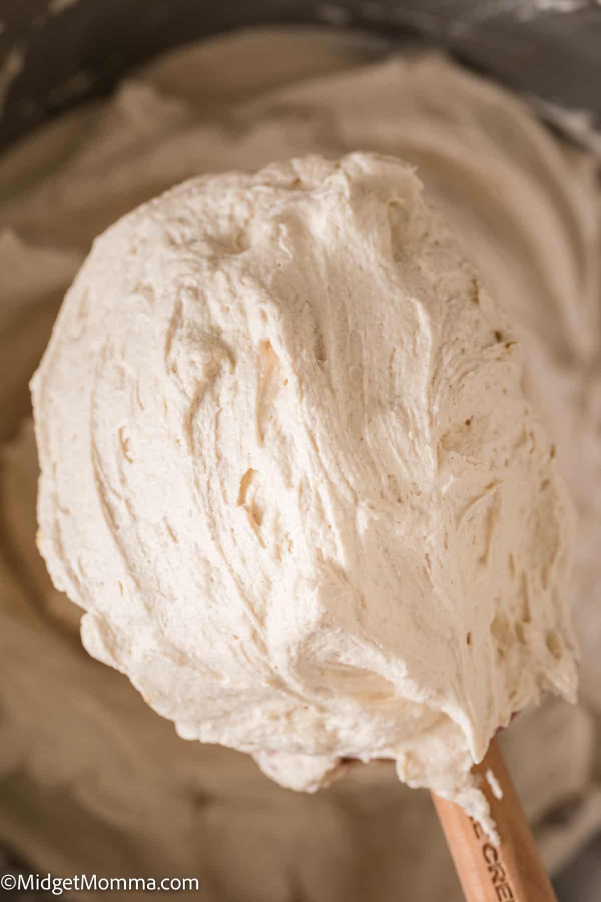close up photo of a spoonful of Peanut butter buttercream frosting 