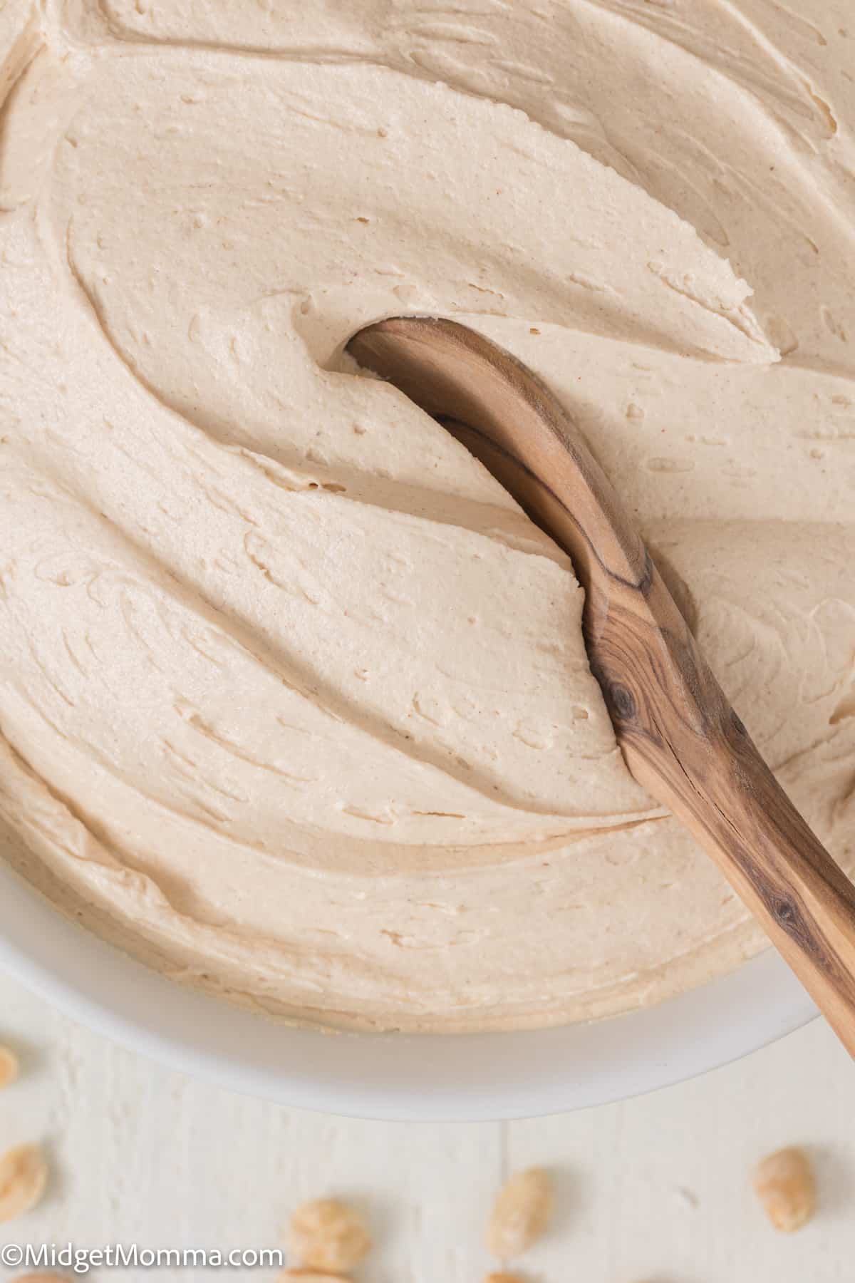 close up photo of a bowl of peanut butter buttercream frosting