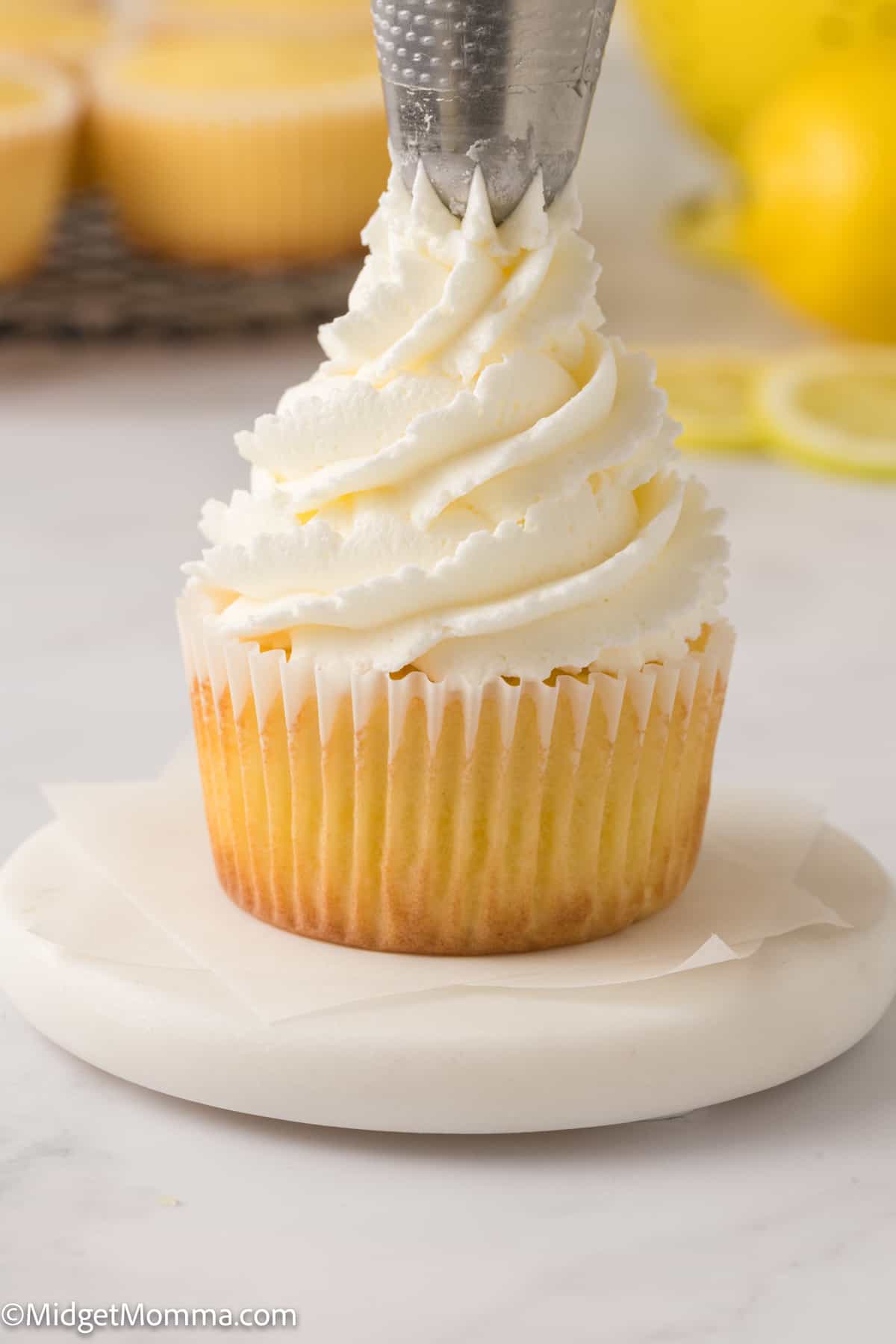 lemon cupcake topped with lemon buttercream frosting