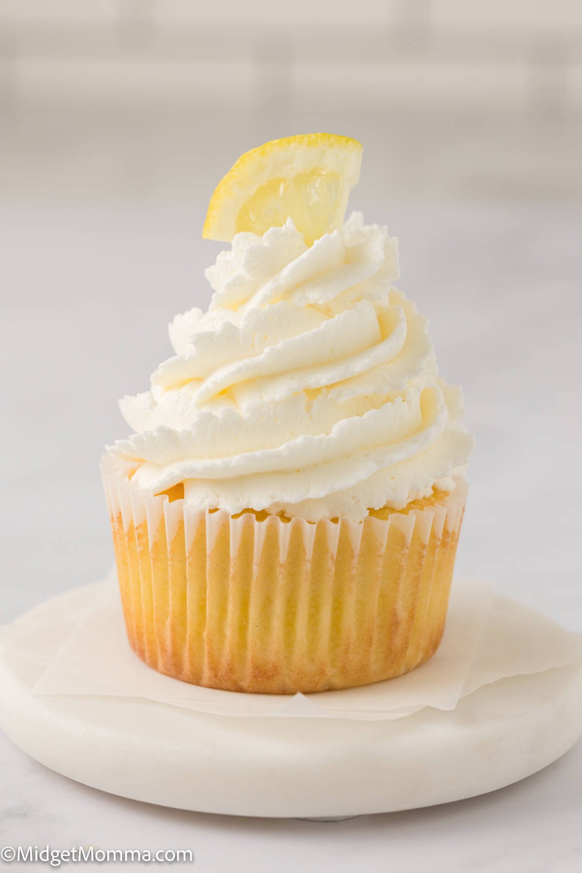 lemon cupcake topped with lemon frosting