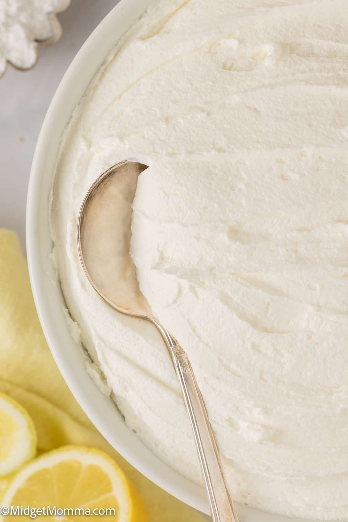 bowl of lemon buttercream with a spoon