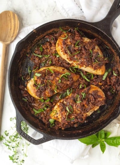 Tuscan chicken finished cooking in a skillet on the counter