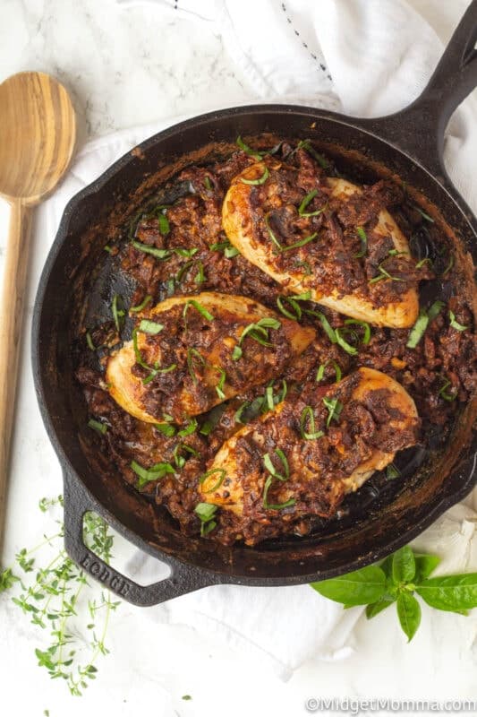 Tuscan chicken finished cooking in a skillet on the counter