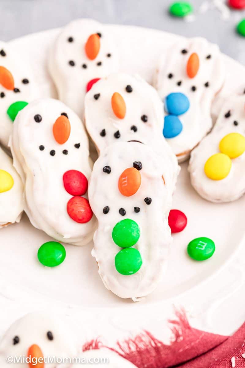 Chocolate Dipped Nutter Butter Snowman Cookies • MidgetMomma