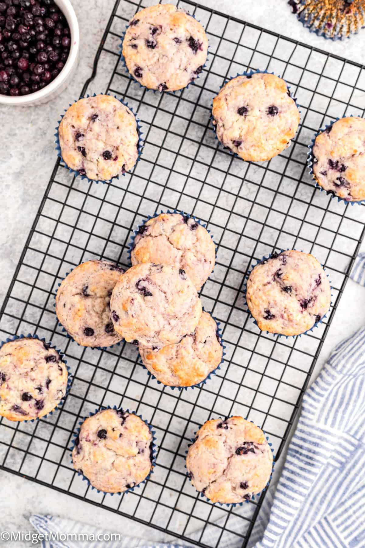 stack of Greek Yogurt Blueberry Muffins on a cooling rack