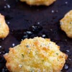 Keto Cheddar Biscuits on a baking sheet right out of the oven