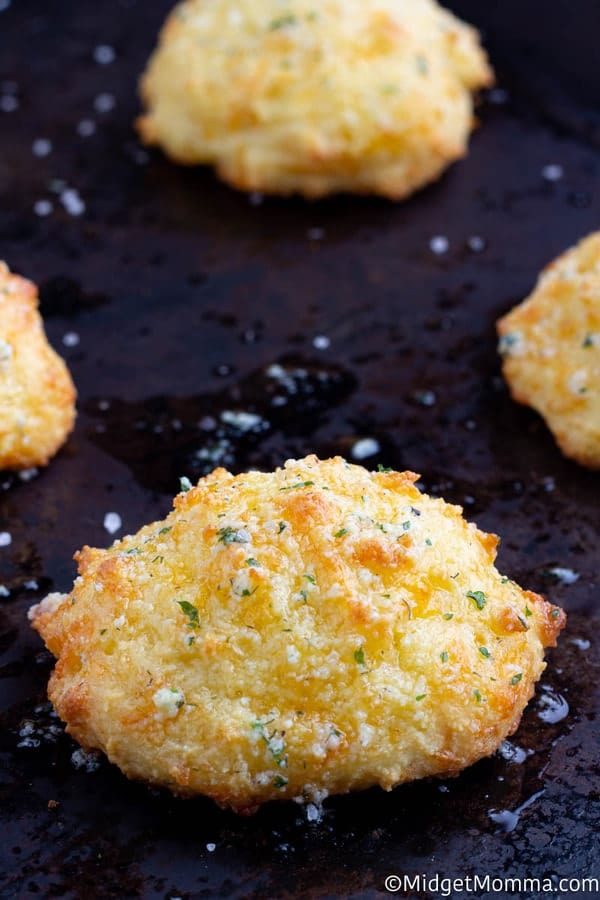 Keto Cheddar Biscuits on a baking sheet right out of the oven