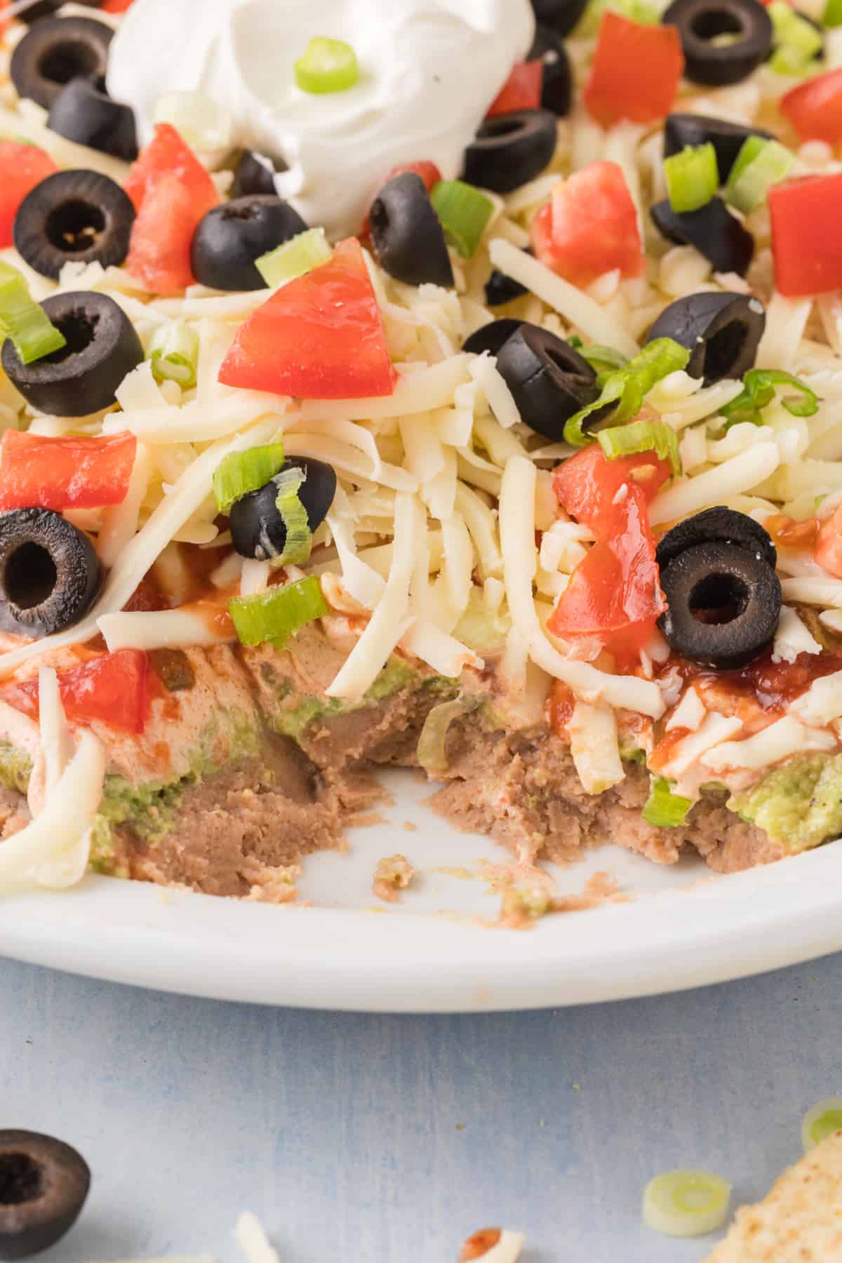 Mexican dip on a white plate.