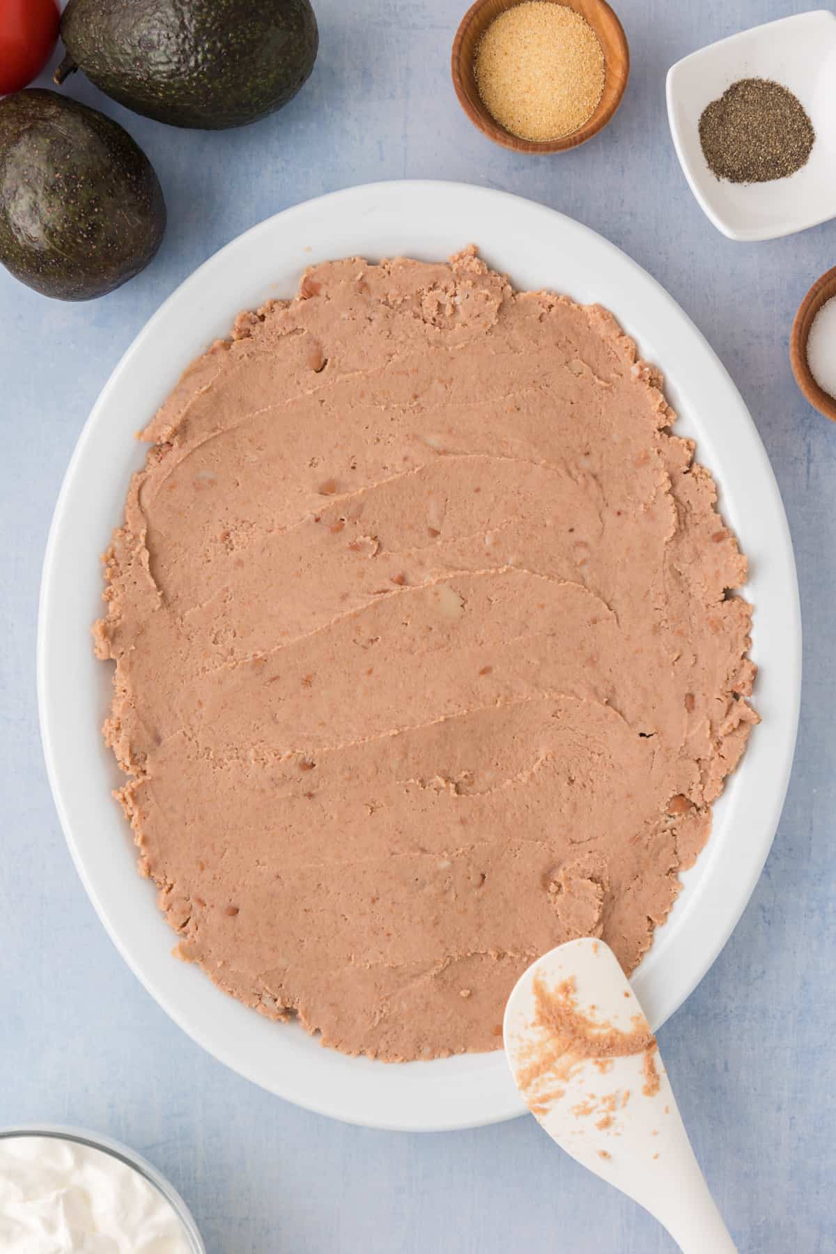 refried beans onto a serving platter