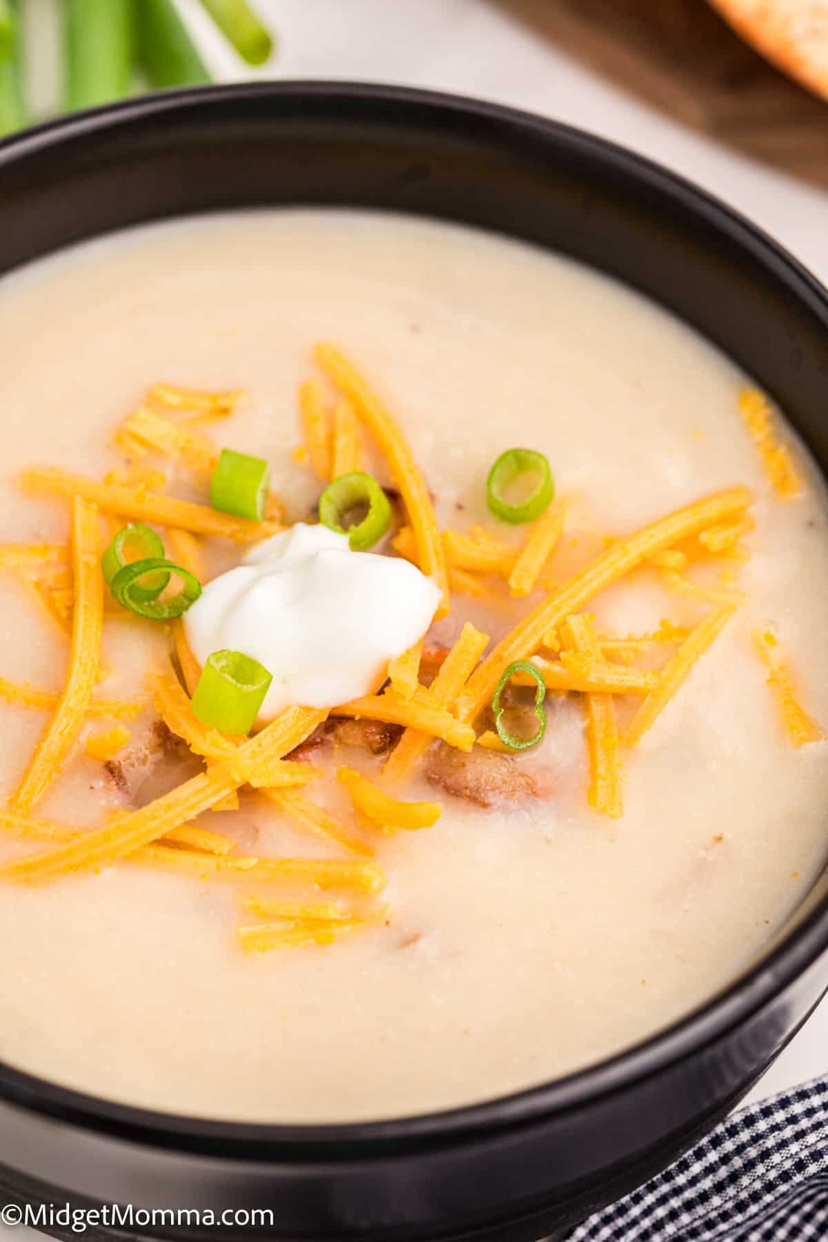 baked potato cauliflower soup in a bowl