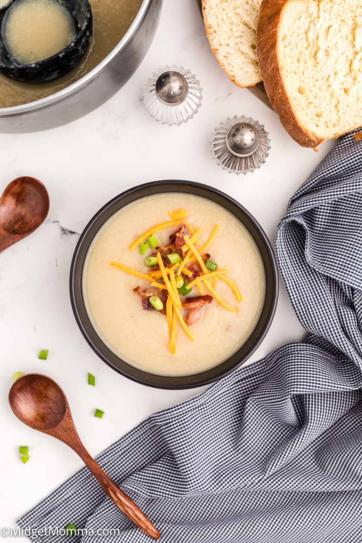 overhead photo of a bowl of baked potato cauliflower soup