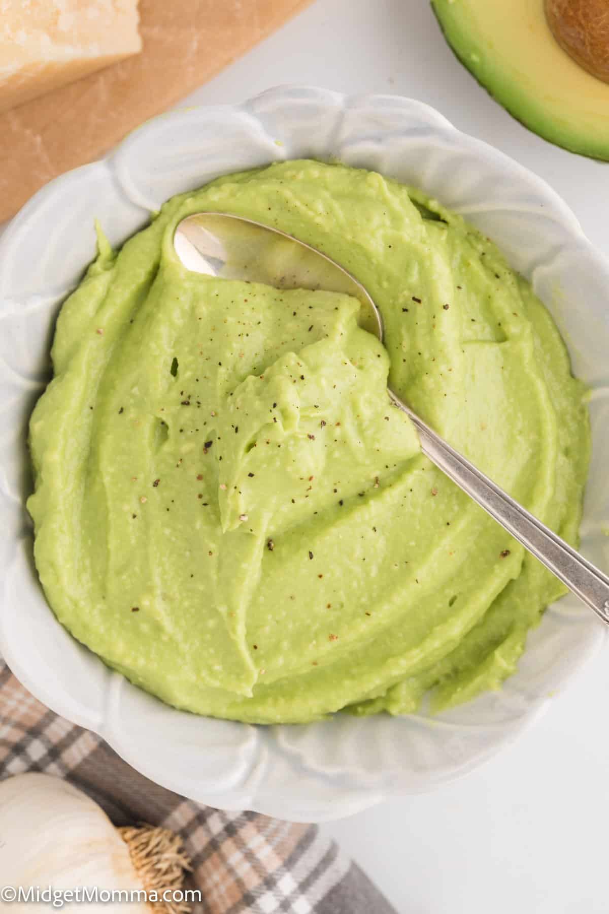 bowl of roasted garlic avocado pasta sauce