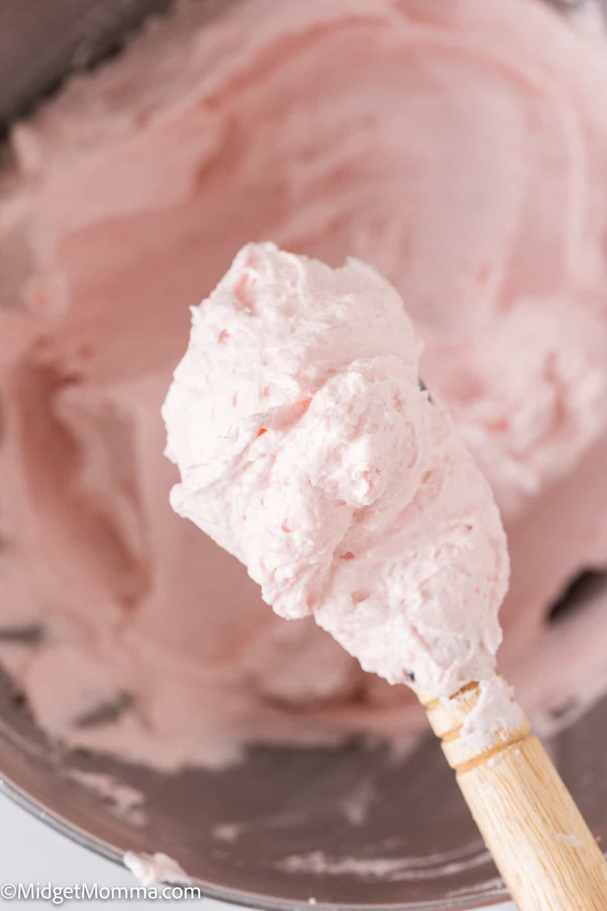 spoonful of Strawberry buttercream frosting 