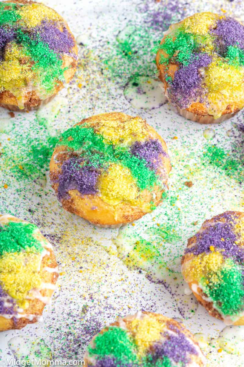 Cinnamon muffins topped with sugar icing and colored sugar