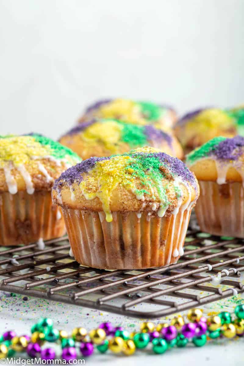 Cinnamon Muffins with icing and colored sugar recipe cooling on a baking rack