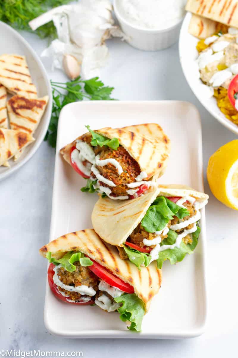 Homemade Falafel Wraps with Tzatziki Sauce on a platter