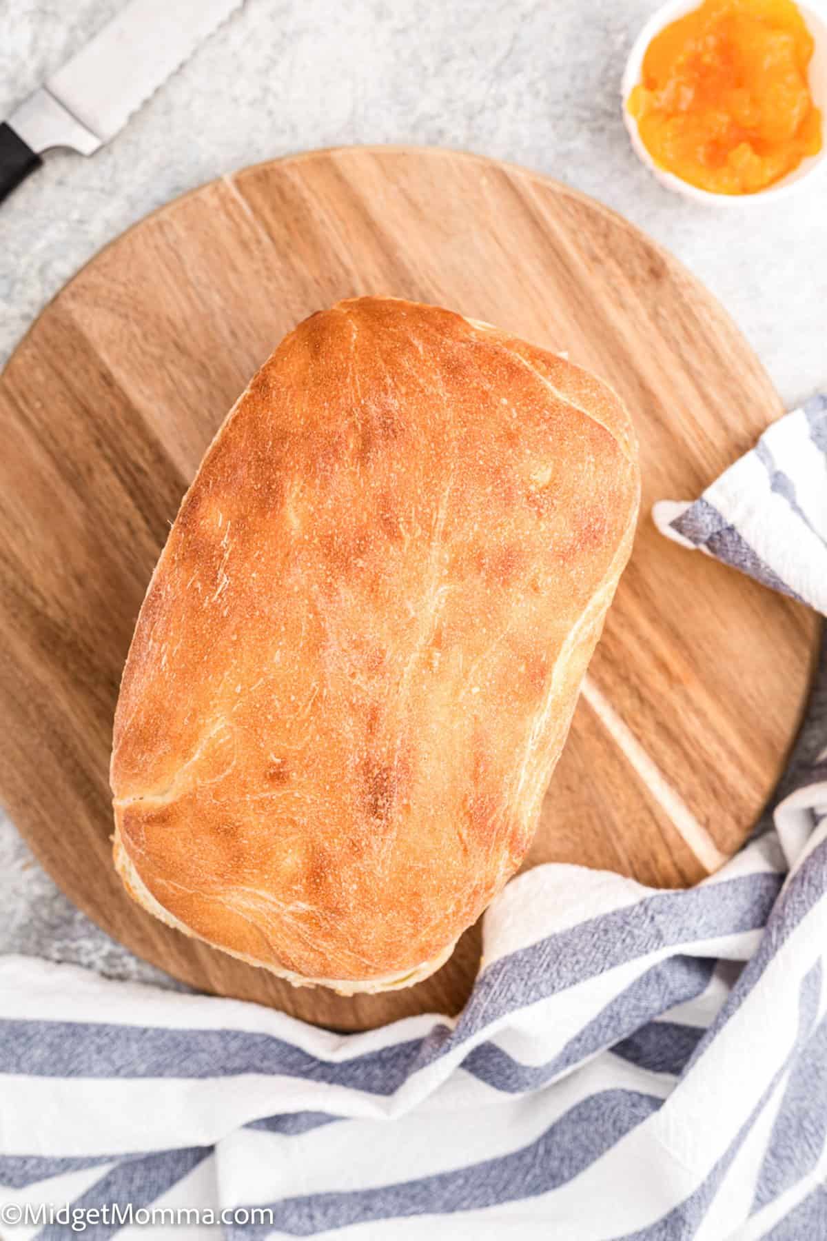 over head photo of Homemade White Bread loaf on a cutting board