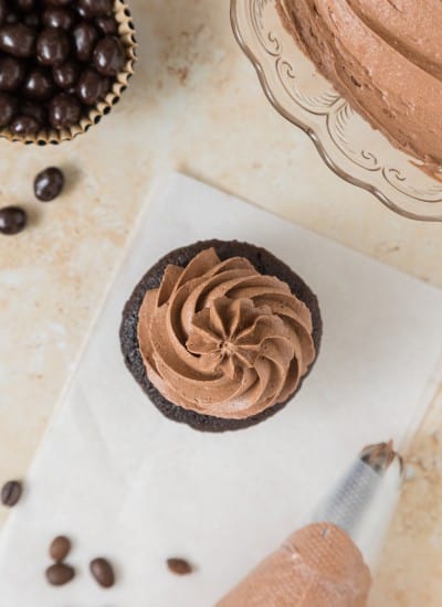 Mocha Buttercream Frosting Recipe on top of a chocolate cupcake