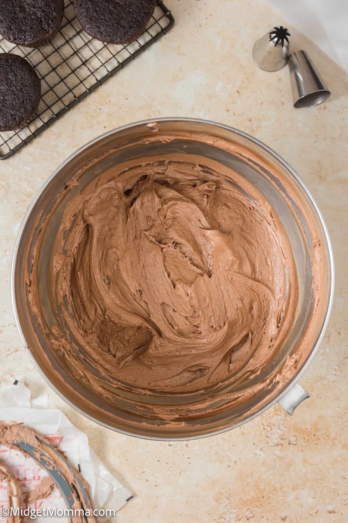standmixer bowl filled with mocha buttercream frosting