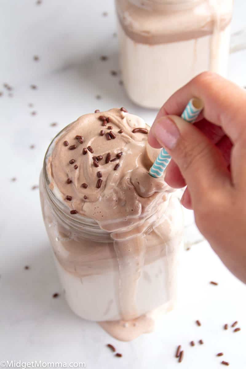 stirring hot milk with whipped chocolate 