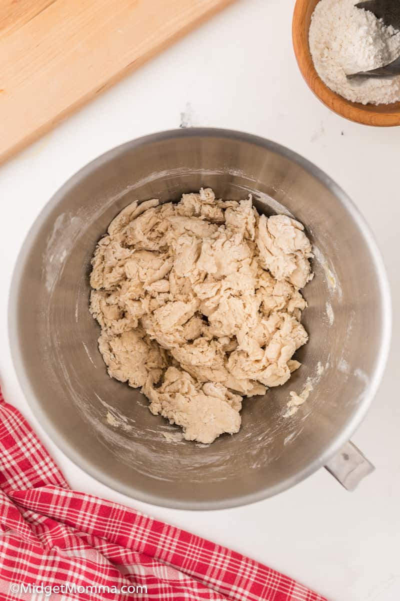 pizza dough forming in the mixing bowl