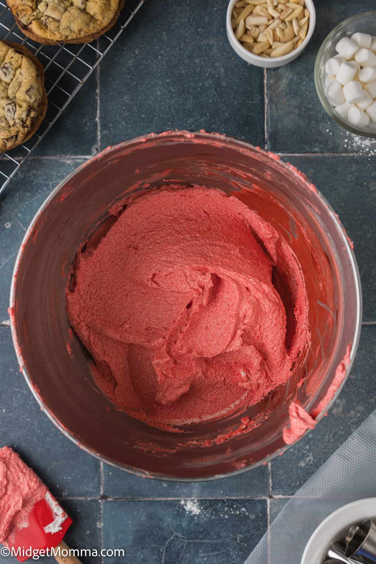 red buttercream frosting in a bowl
