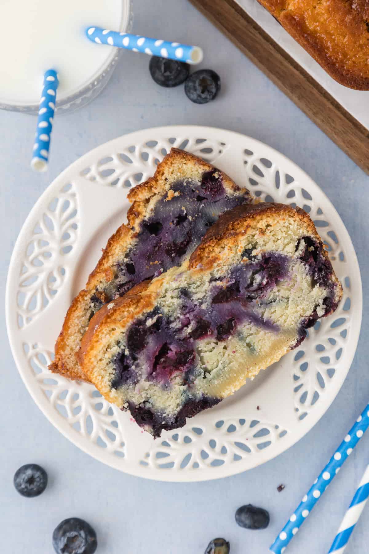 A slice of blueberry bread on a plate.