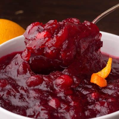 the best cranberry sauce recipe in a bowl on a spoon