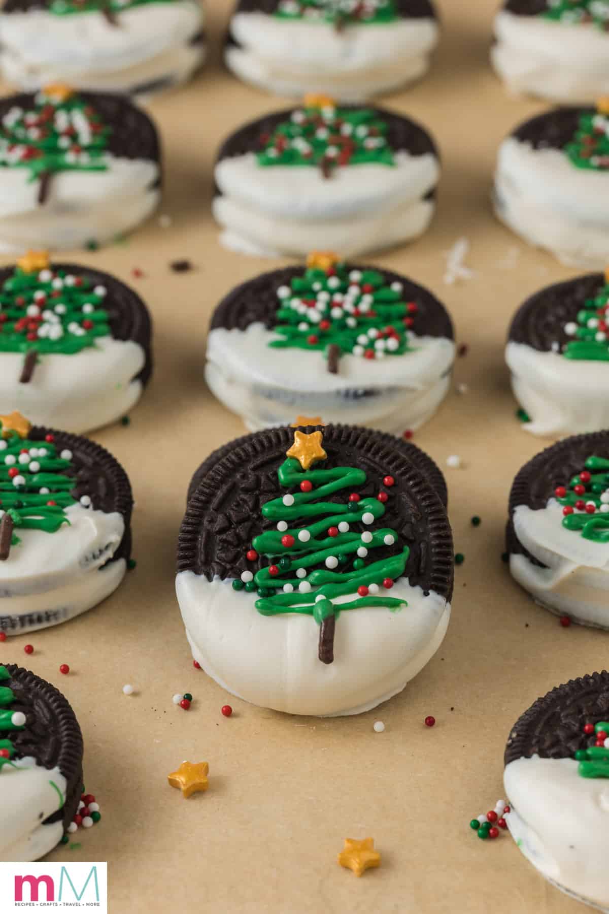 close up photo of christmas oreo cookies decorated with a christmas tree 