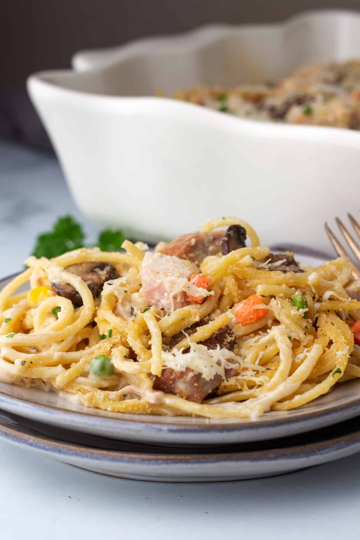 grey plate with Turkey Tetrazzini  and a fork