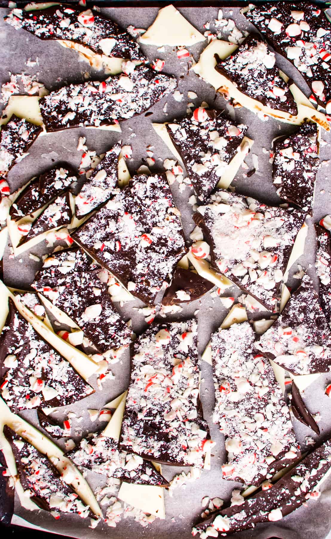 Chocolate and peppermint bark on a baking sheet.