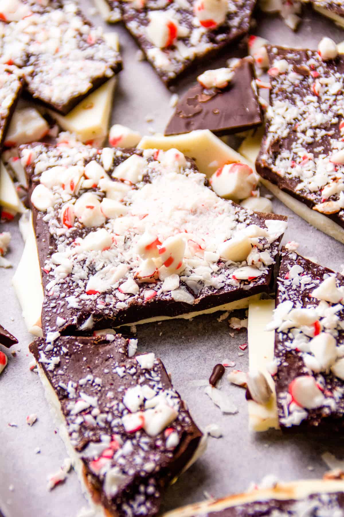 close up photo of a baking sheet with chocolate peppermint bark
