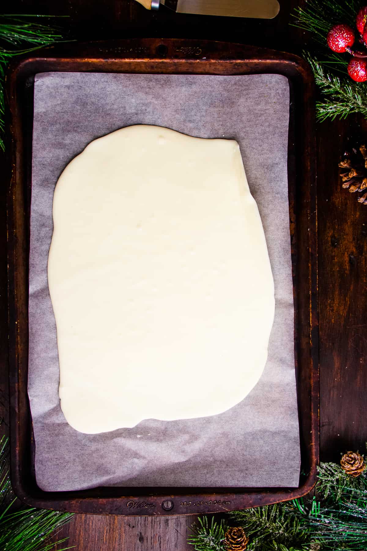 white chocolate spread on a baking sheet