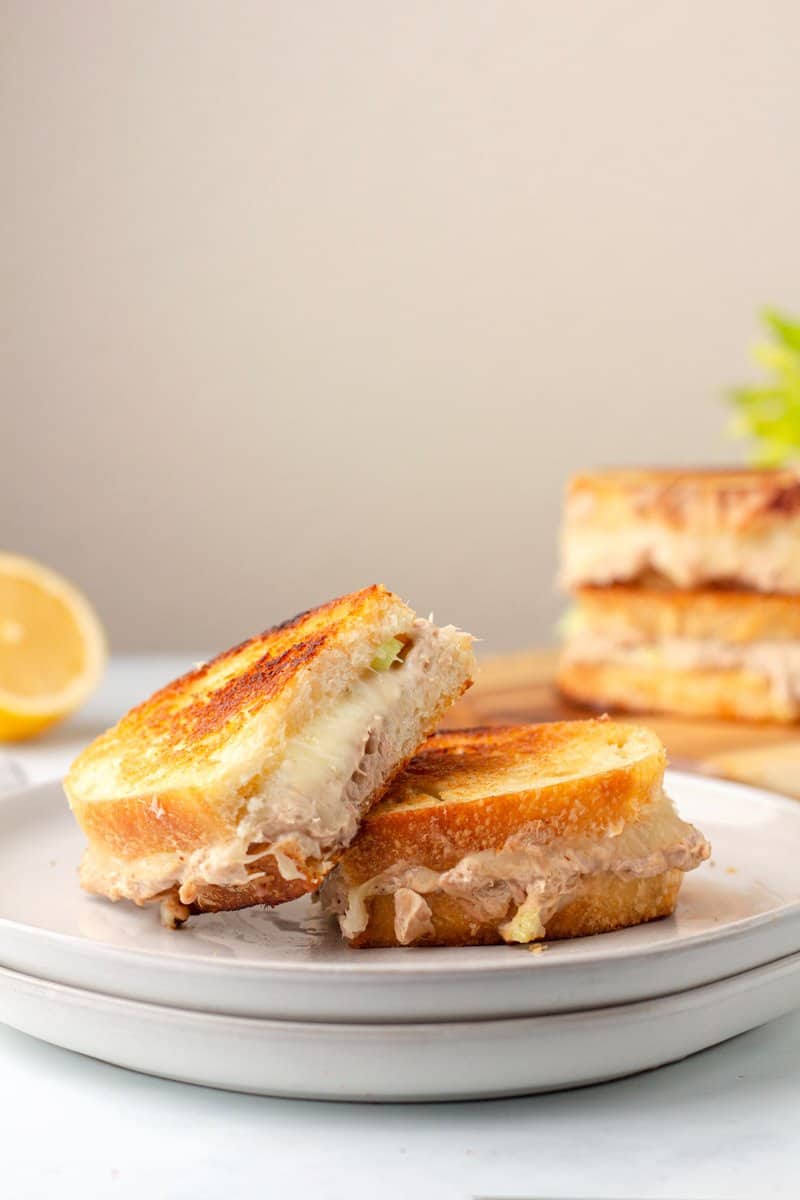 tuna melt cut in half on a plate