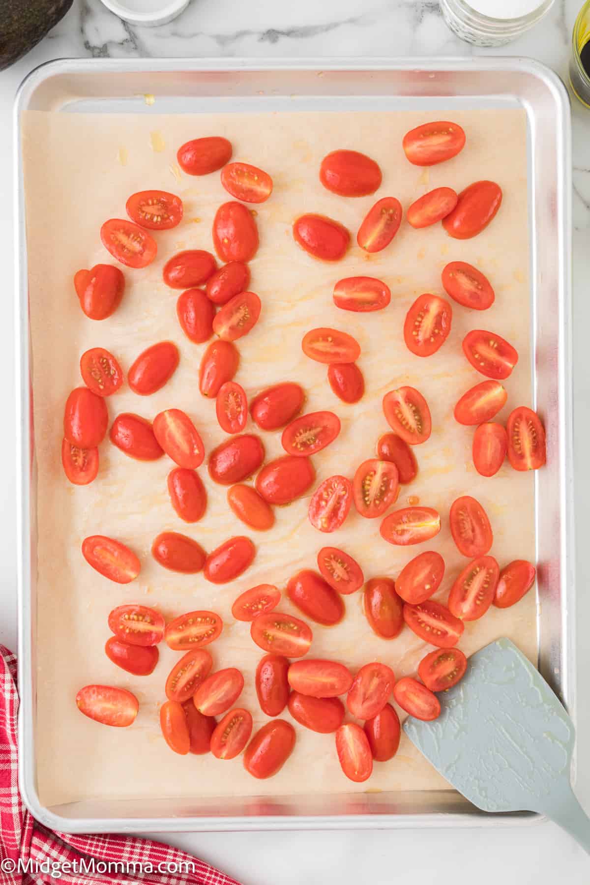 Sliced tomatoes on a baking sheet