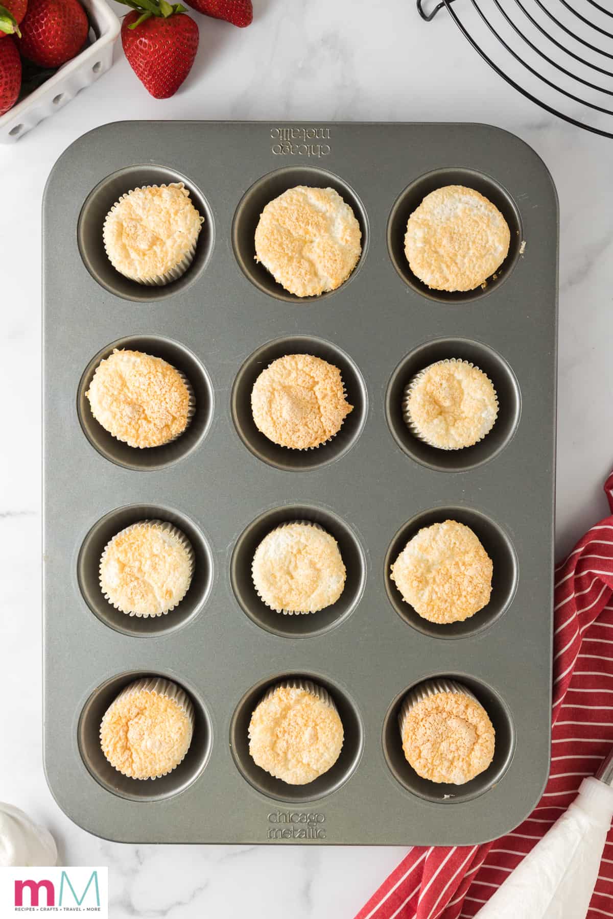 fully baked angel food cake cupcakes in a cupcake pan.