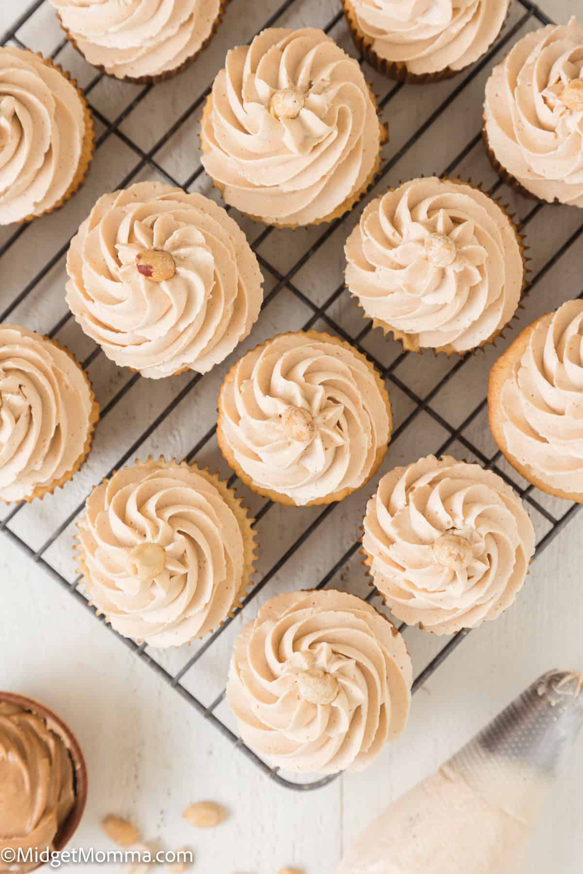 overhead photo of peanut butter cupcakes recipe topped with peanut butter frosting