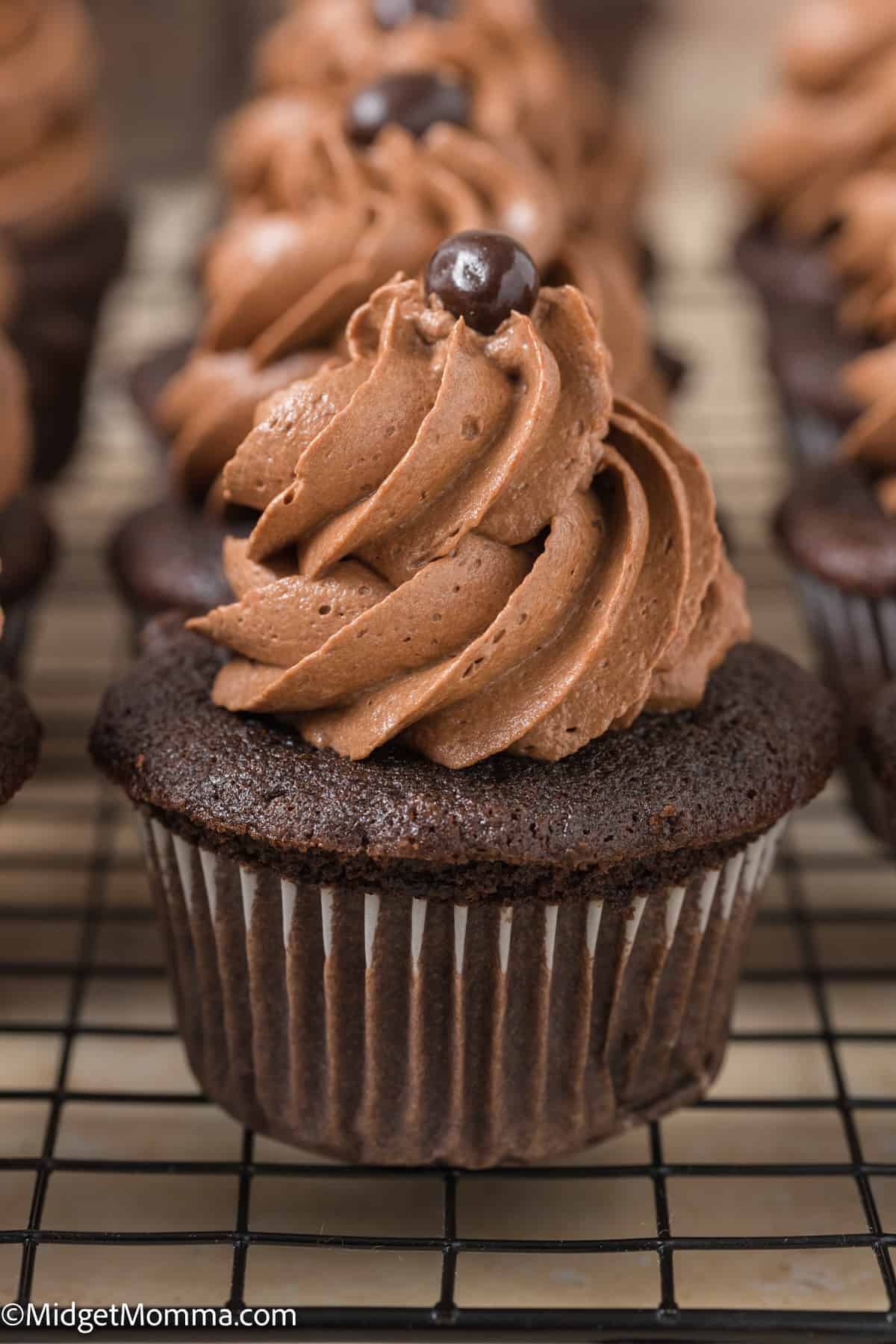 close up photo of a chocolate coffee cupcake on a plate