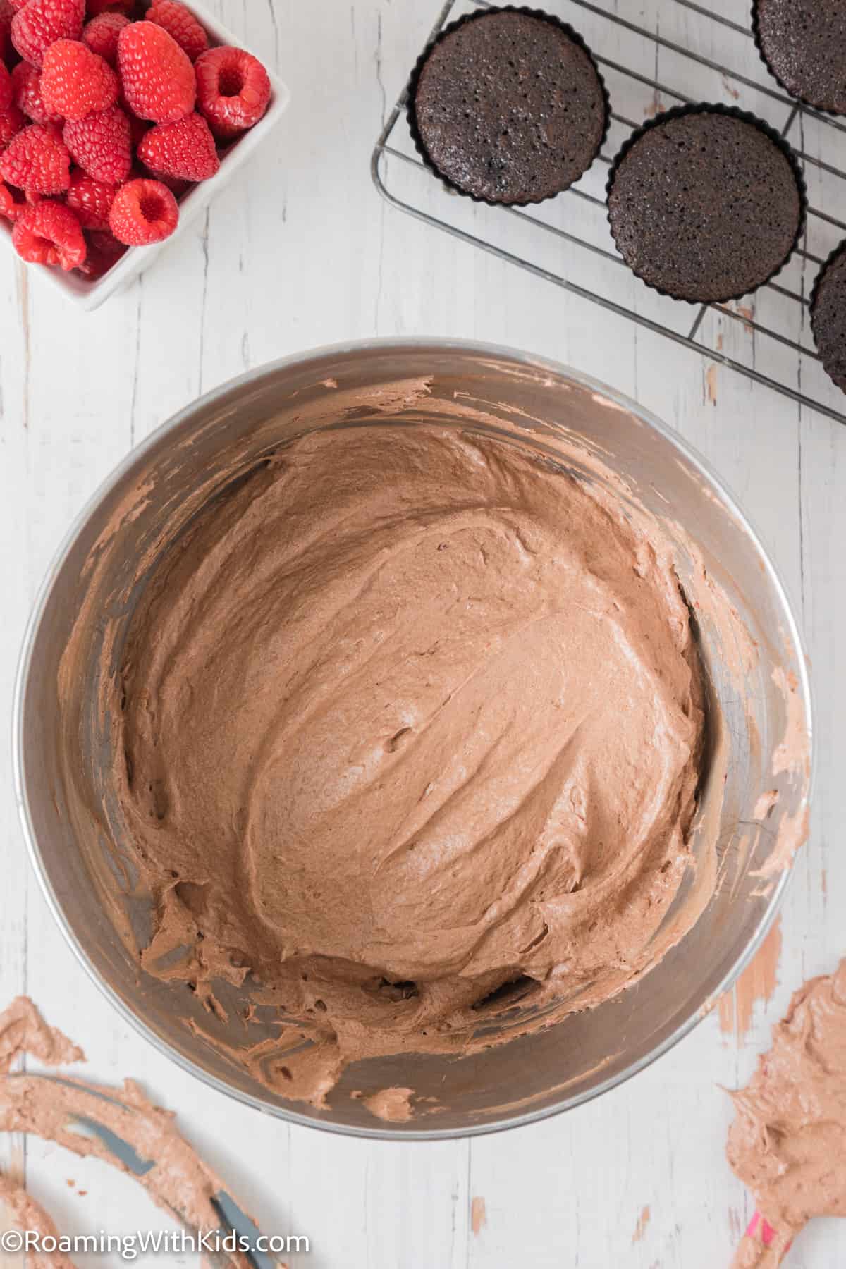 bowl of chocolate raspberry buttercream frosting
