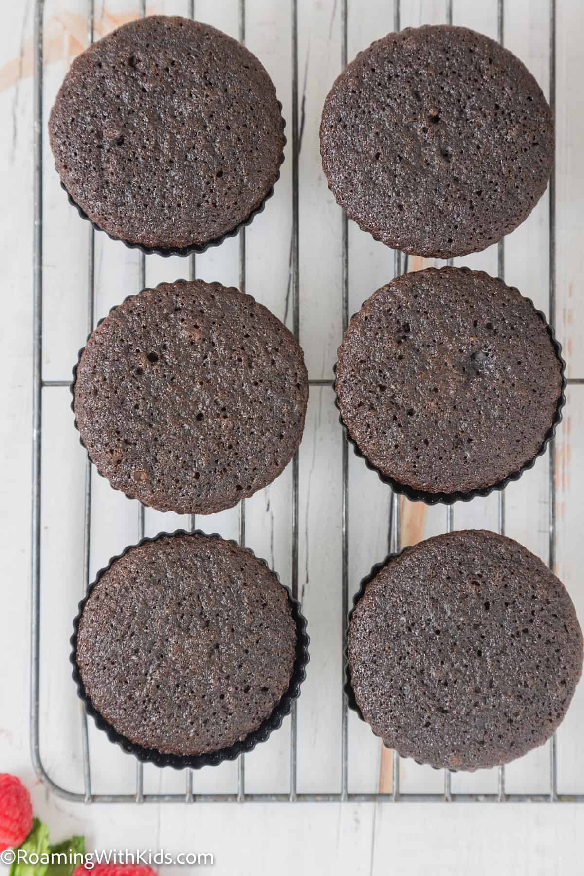 baked chocolate cupcakes on a cooling rack