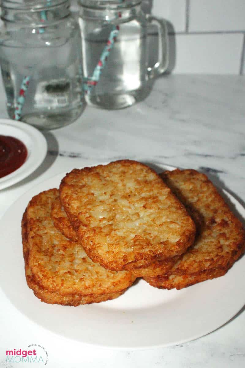 cooked hash browns in air fryer on a plate