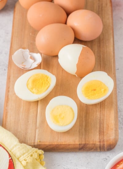 Hard boiled eggs on a cutting board.