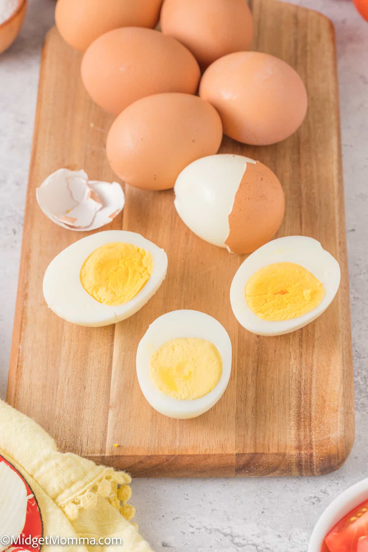 Hard boiled eggs on a cutting board.