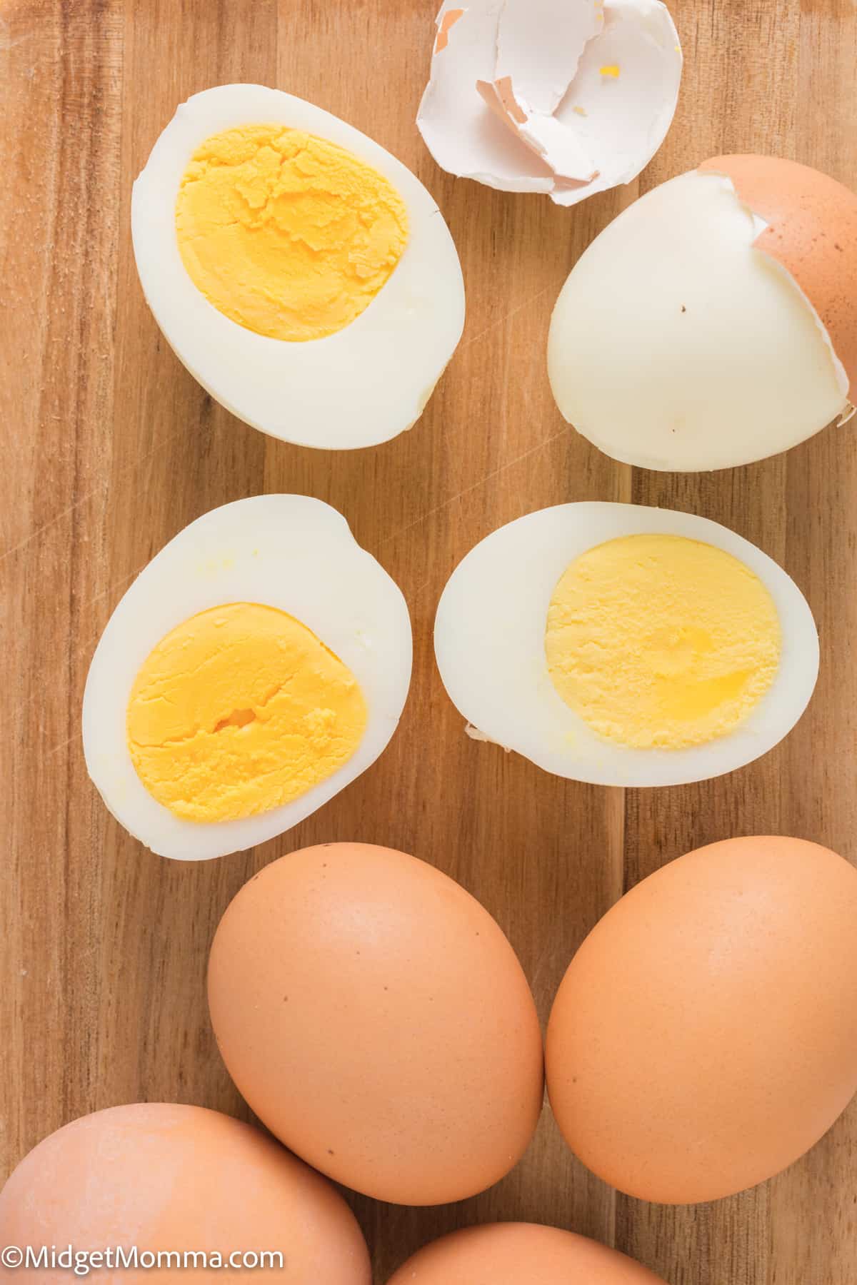 Hard boiled eggs on a cutting board.