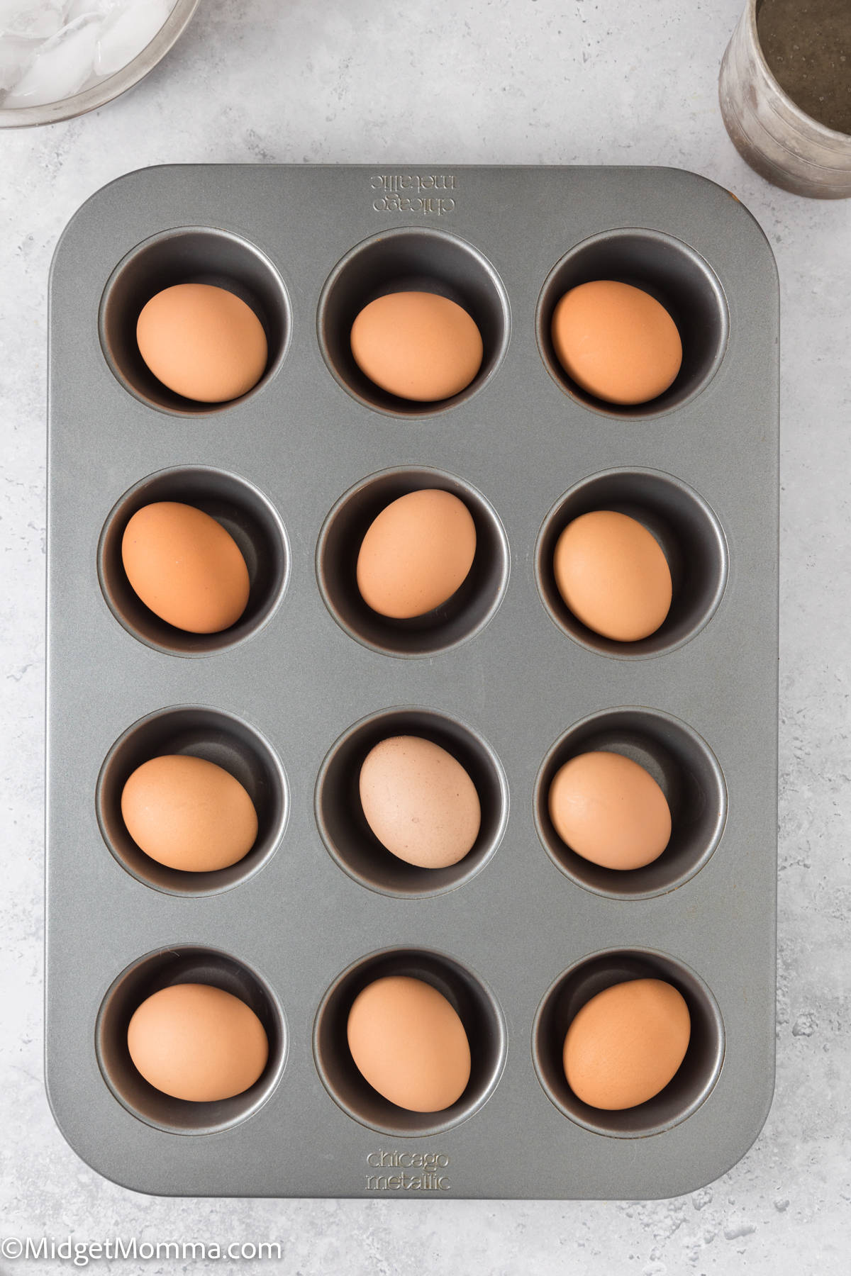 A muffin tin with eggs in it.
